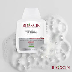 شامبو هيربال كلاسيك للعناية بتساقط الشعر الجاف والعادي 300 مل - بيوكسين Bioxcin